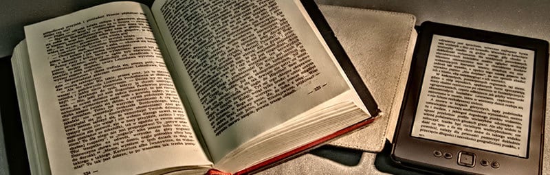 an open book with a digital reader