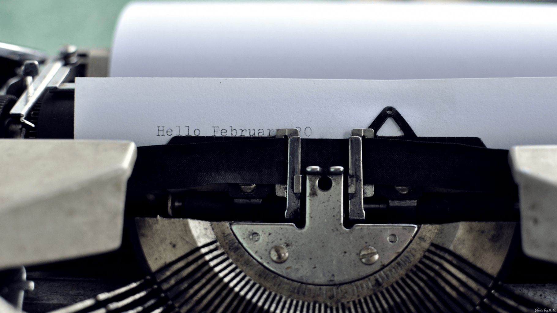 a typewriter typing on a white page