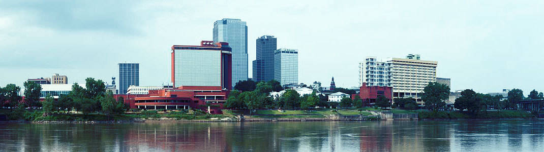 a photo of the downtown Little Rock skyline taken from the north side of the Arkansas River