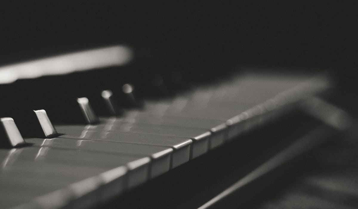 black and white photo of a piano