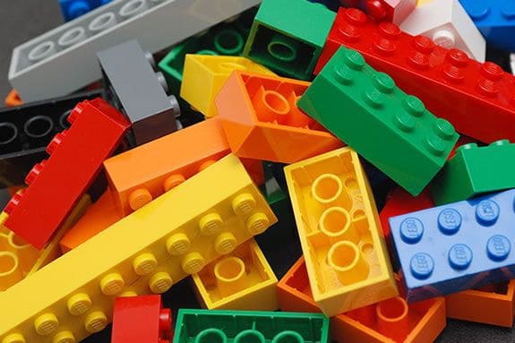 An assortment of lego bricks of various shapes and colors.