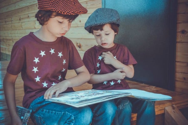 Two Children reading together