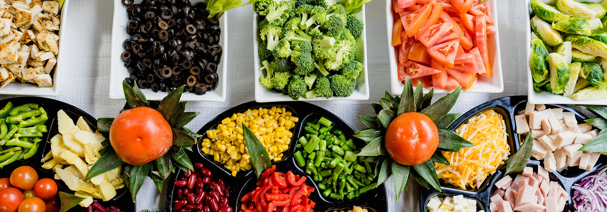 a spread of chopped and sliced meat and vegetables
