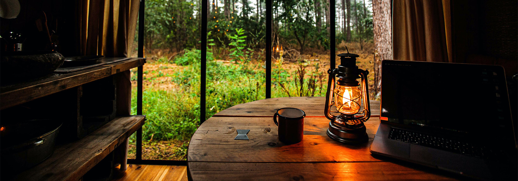 home office with laptop and view of the outdoors.
