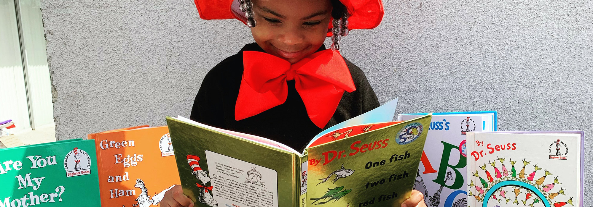 a child reading dr. seuss books