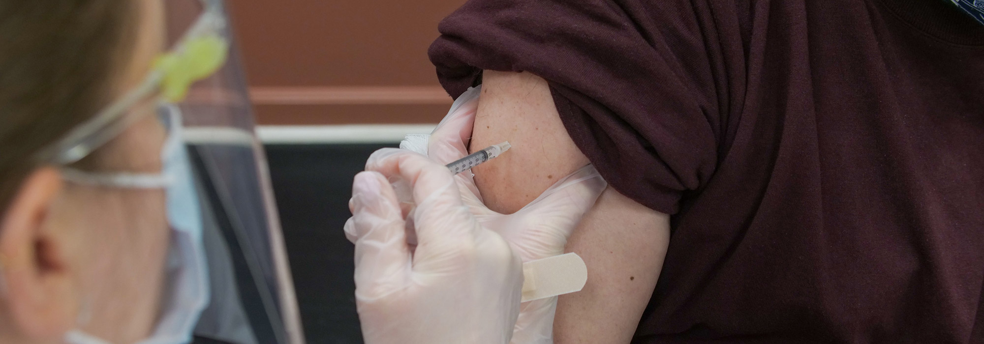 doctor administering a shot
