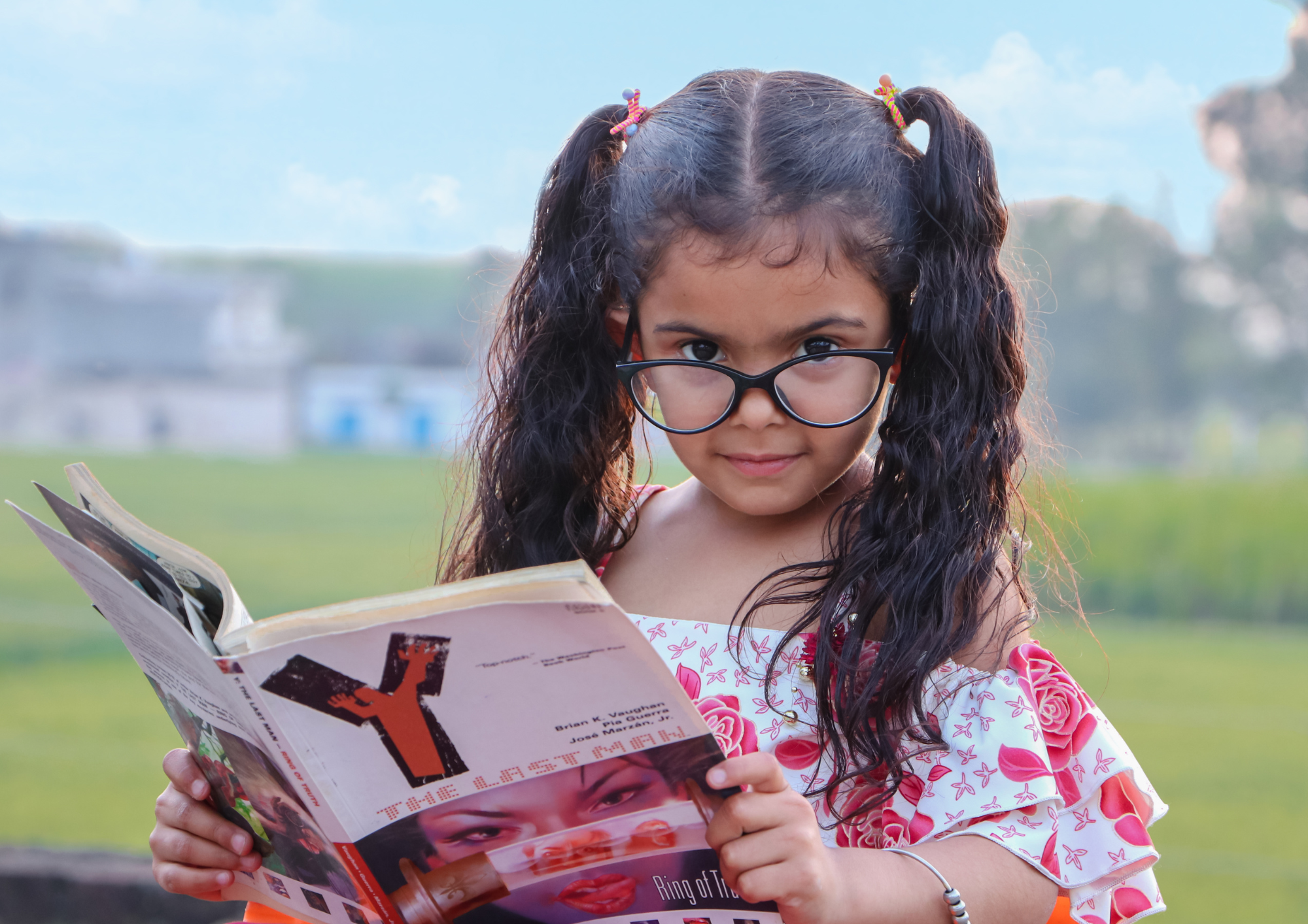 girl in glasses reading book