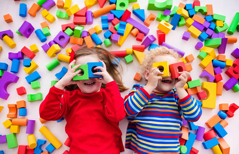 kids with blocks over their eyes
