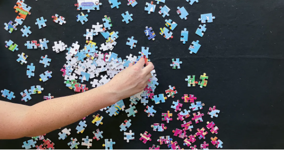 person working a puzzle