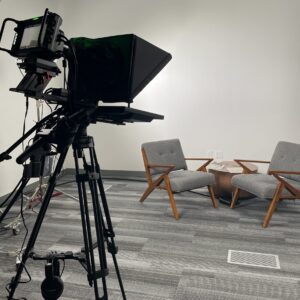 two chairs and a table with video camera pointed at them