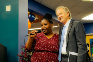 Williams Library Branch Manager Latina Sheard and Nate Coulter celebrate the reopening of the Sue Cowan Williams Library during Family Dinner Night in 2024. (Photo: NOIRE and Simeon Norfleet)